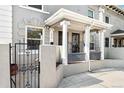 Inviting townhouse with classic architectural details and secure gated entry at 1914 E 16Th Ave, Denver, CO 80206