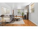 Bright living room with a cozy fireplace and modern decor at 1914 E 16Th Ave, Denver, CO 80206