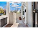 Cozy front porch with detailed railing and a secure gated entrance at 1914 E 16Th Ave, Denver, CO 80206