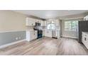 Spacious kitchen with modern appliances, white cabinets, and ample counter space at 2888 S Fundy St, Aurora, CO 80013