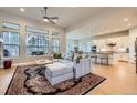 Open-concept living room with high ceilings, hardwood floors, and modern decor at 1766 Summerglow Ln, Monument, CO 80132