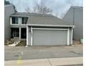 Charming two-story townhome with an attached two-car garage, showing the entrance at 12973 E Cornell Ave, Aurora, CO 80014