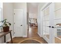 Bright foyer with hardwood floors and view to the living room at 20998 E 60Th Pl, Aurora, CO 80019