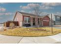 A cozy single-Gathering home showcasing a landscaped front yard and charming curb appeal with a covered porch at 13601 Krameria St, Thornton, CO 80602