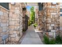 Stone pillars along the walkway provide privacy and a visual feature at 3329 Molly Ln, Broomfield, CO 80023