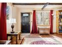 Welcoming entryway featuring hardwood floors, stylish lighting, and charming decor creating a warm and inviting atmosphere at 17422 N Canyon Rd, Littleton, CO 80127