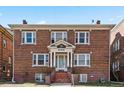 Charming brick apartment building featuring a symmetrical design and central entrance with 'Biltmore' sign at 945 N Washington St # 201, Denver, CO 80203