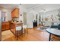 Open living space with an eat-in kitchen, hardwood floors, and lots of natural light at 945 N Washington St # 201, Denver, CO 80203