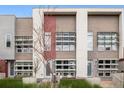Modern townhome featuring unique architectural details and private patios, creating a contemporary and inviting facade at 2815 W 52Nd Ave, Denver, CO 80221