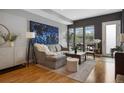 Comfortable living room with large windows, plush seating, and stylish accents, perfect for relaxing and entertaining at 2815 W 52Nd Ave, Denver, CO 80221