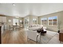 Open concept living and dining area with ample seating and natural light at 17196 W 92Nd Loop, Arvada, CO 80007