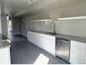 White kitchen cabinets, white subway tile backsplash and stainless steel appliances at 1642 N Lafayette St # 2, Denver, CO 80218