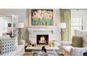 Cozy living room featuring a fireplace, mantel, and comfortable seating at 140 Race St, Denver, CO 80206
