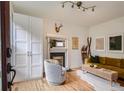 Bright living room with hardwood floors, fireplace, stylish furniture, and decorative accents at 1217 E 26Th Ave, Denver, CO 80205