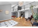 Open foyer with staircase, high ceilings and modern black metal banister at 9505 Poundstone Pl, Greenwood Village, CO 80111