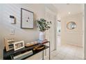 Inviting hallway with tile flooring, modern decor, and a glimpse into other rooms at 1767 N Pearl St # 308, Denver, CO 80203