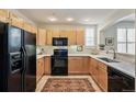 Well-equipped kitchen featuring stainless steel appliances, light wood cabinets, and white countertops at 1767 N Pearl St # 308, Denver, CO 80203