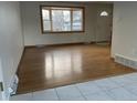 Bright living room featuring hardwood floors and a large bay window at 3062 S Florence Ct, Denver, CO 80231