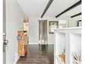 Inviting entryway showcasing hardwood floors, exposed beams, and a neutral color palette at 217 Ford St, Golden, CO 80403