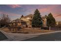 Charming home with mature landscaping, brick accents, and a welcoming entrance at 9368 S Silent Hills Dr, Lone Tree, CO 80124