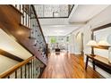 Stunning foyer featuring hardwood floors, an elegant staircase, and abundant natural light at 1317 S Saint Paul St, Denver, CO 80210