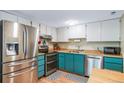 Well-lit kitchen with stainless steel appliances and a eat-in breakfast area at 12565 Eudora St, Thornton, CO 80241