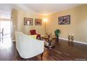 Cozy living room with hardwood floors, neutral paint, and ample natural light at 1050 S Monaco Pkwy # 126, Denver, CO 80224