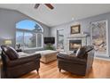 Cozy living room features large windows, a fireplace, and comfortable seating at 508 Viola St, Palmer Lake, CO 80133