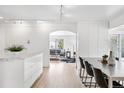 Open-concept home with a view from the dining area into the living room and beyond at 2675 S Eudora St, Denver, CO 80222