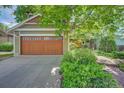 Two car garage featuring paneled wood doors and ample parking at 3966 Bosque Ct, Boulder, CO 80301