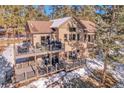 Two story home with large deck and mountain views at 23148 Pawnee Rd, Indian Hills, CO 80454