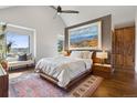 Inviting main bedroom with a bright, airy space, complemented by a serene view and stylish decor at 9703 Phillips Rd, Lafayette, CO 80026
