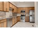 Modern kitchen with granite countertops and stainless steel appliances at 1839 Grove St, Denver, CO 80204