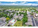 Spacious neighborhood with lush trees and community pool on a bright, sunny day at 1250 S Monaco Pkwy # 67, Denver, CO 80224