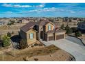 Stunning aerial view of the beautiful neighborhood and property with mature landscaping and a fenced backyard at 3214 Timeless Trl, Berthoud, CO 80513