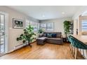 Bright living room featuring hardwood floors, ample natural light, and stylish modern furniture at 1277 Wabash St, Denver, CO 80220