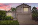 Charming two-story home with a well-maintained lawn, attached two car garage and manicured landscaping at 11864 N Chase Ct, Westminster, CO 80020