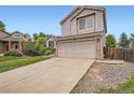 Charming two-story home with a well-maintained lawn, attached two car garage and extra long driveway at 11864 N Chase Ct, Westminster, CO 80020