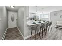 Bright, updated living space featuring an open-concept design and a door leading out at 1390 Everett Ct # 105, Lakewood, CO 80215