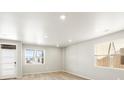 Spacious living room with ample natural light, neutral paint and nice wood flooring at 764 N Tempe St, Aurora, CO 80018