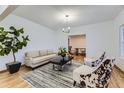 Bright living room featuring hardwood floors, neutral decor, and stylish furnishings at 5749 S Lansing Way, Englewood, CO 80111