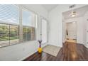 Bright entryway featuring wood floors, natural light, and a view into the home at 2502 S Bahama Cir # B, Aurora, CO 80013