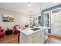 Bright kitchen featuring a modern island, updated appliances and breakfast nook at 2 S Monroe St, Denver, CO 80209