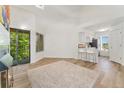 Living room flows into kitchen with easy access to balcony at 4850 E Kentucky Ave # C, Denver, CO 80246
