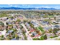 Beautiful aerial view showcasing the home's location and surrounding neighborhood with mountain views at 14533 W 69Th Pl, Arvada, CO 80004