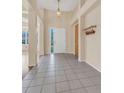 Welcoming foyer with neutral colors, tile flooring, and high ceilings at 1606 Iris St, Broomfield, CO 80020