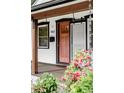 Close up of the entrance featuring a front door and lush plants at 4421 Raleigh St, Denver, CO 80212