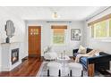 Bright living room with a fireplace, hardwood floors, and stylish furnishings at 4421 Raleigh St, Denver, CO 80212
