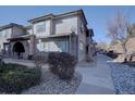 Multi-level home featuring modern architecture and stone accents at 6722 S Winnipeg Cir # 102, Aurora, CO 80016