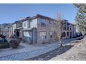 Charming townhome featuring brick and siding exterior, landscaped grounds, and inviting curb appeal at 6722 S Winnipeg Cir # 102, Aurora, CO 80016
